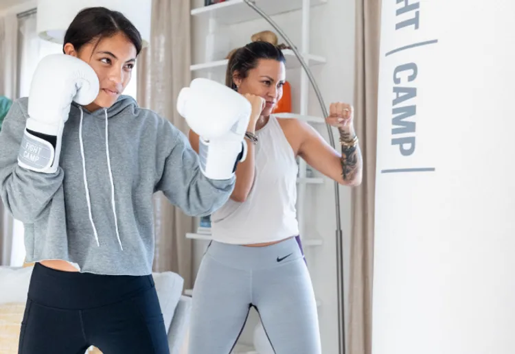 Woman and girl boxing